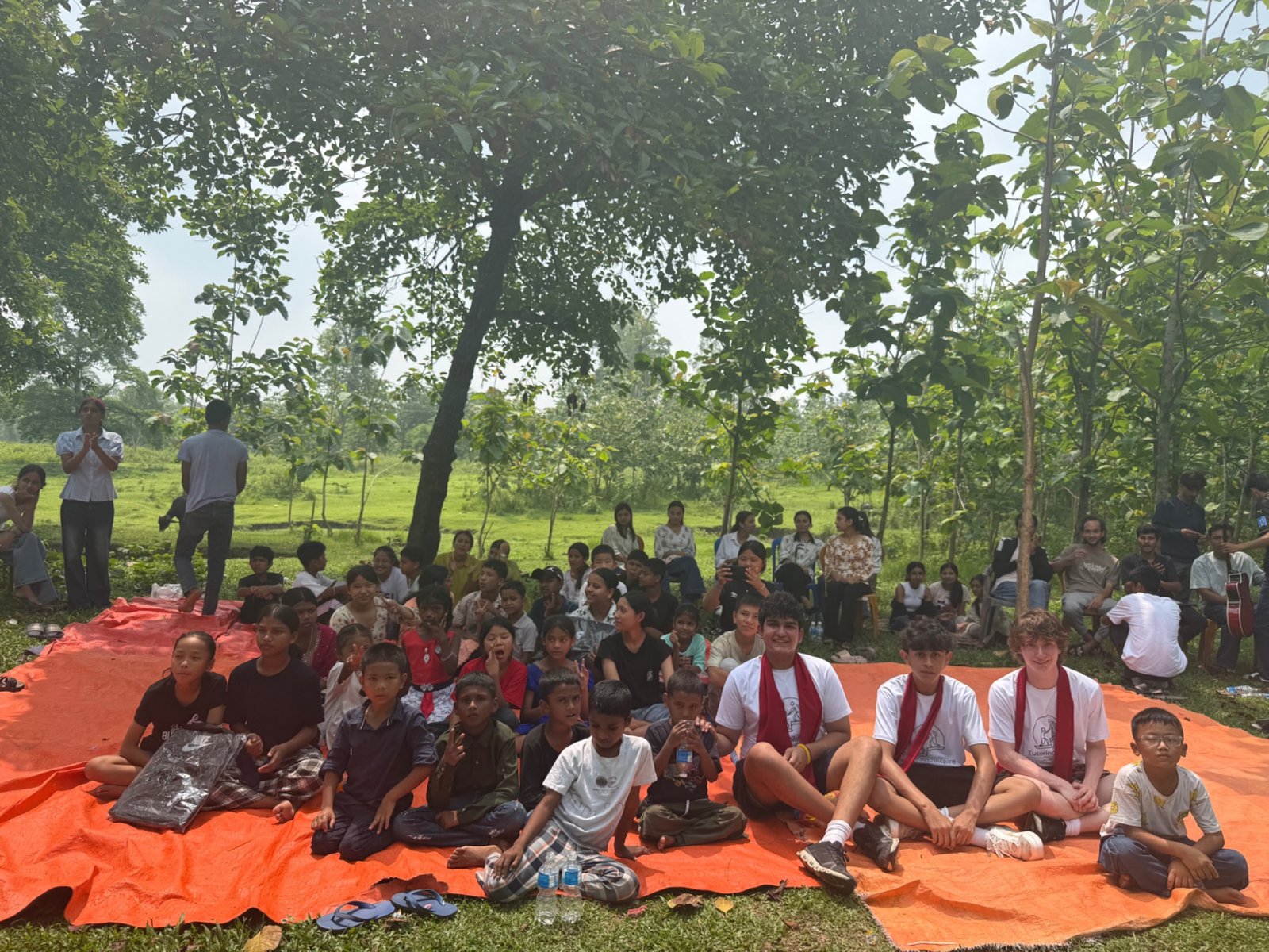 Students and Tutoring2Inspire members gathered outdoors