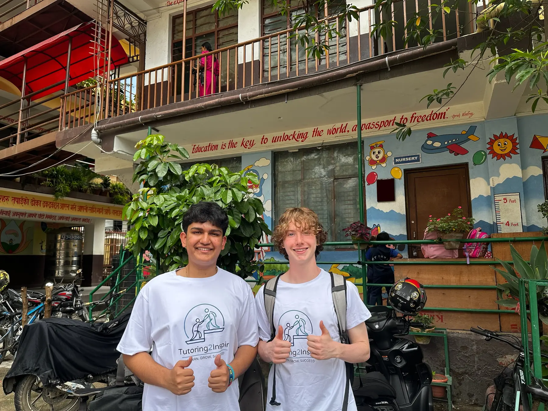 Co-founders Jay Panta and Sam Keon together outside a school in Nepal